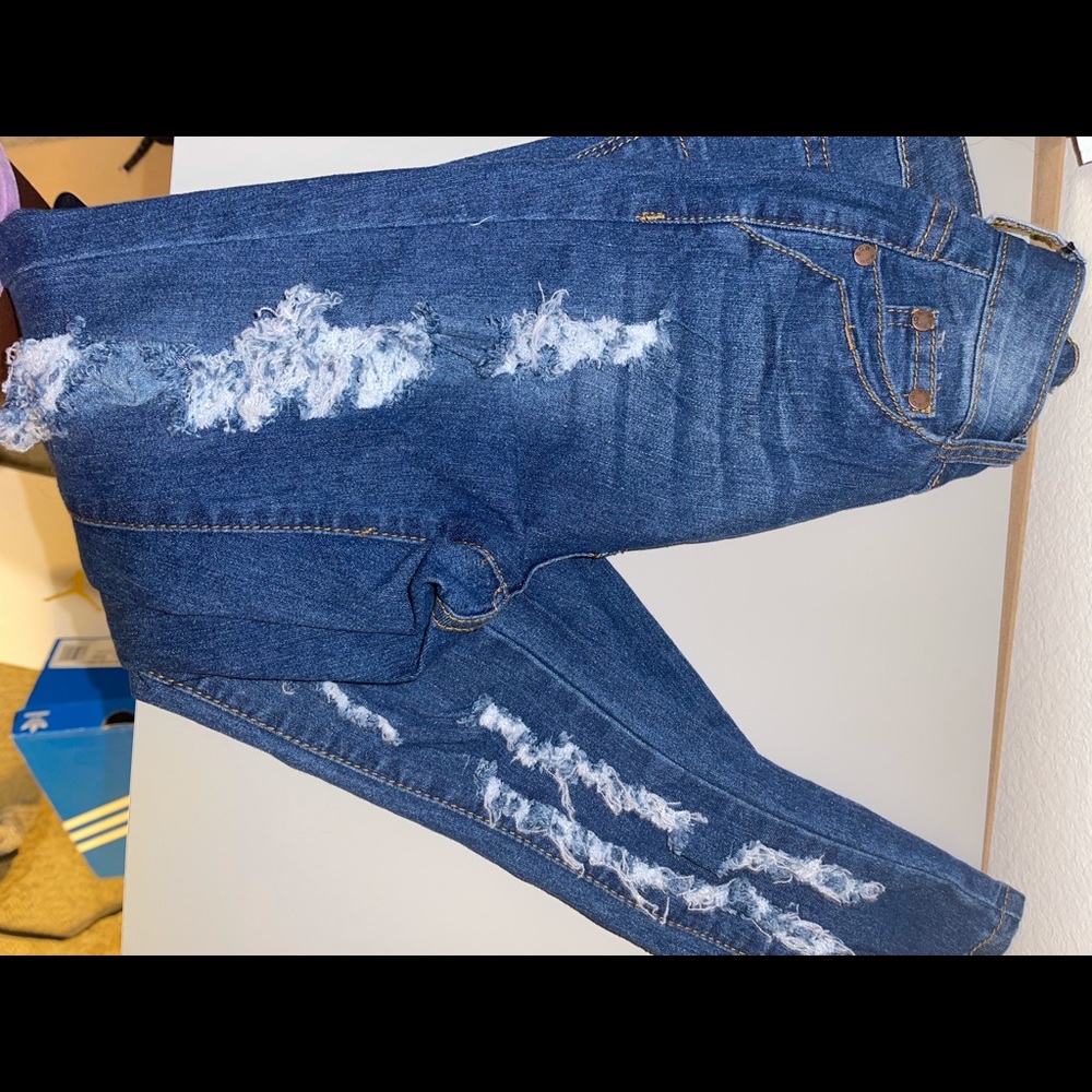 Brand new distressed jeans